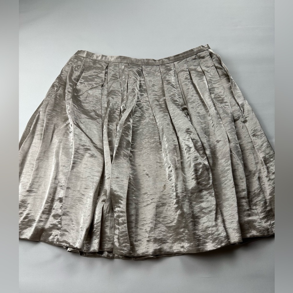 WHBM Champagne color silky-like feel/shiny/flowy skirt. Size 12